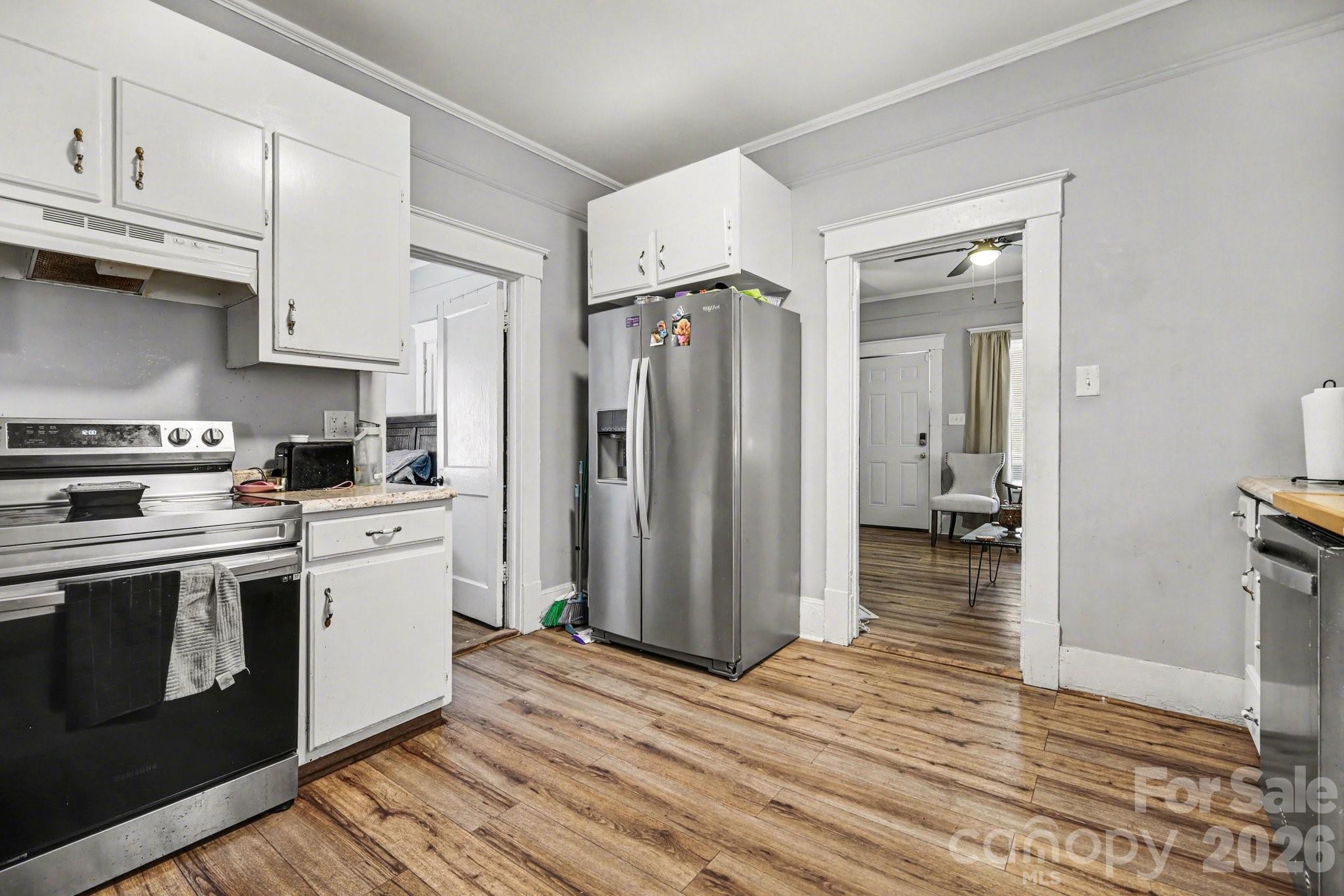 522 Elm Street Salisbury, NC 28144 - Photo 9 of 20 a kitchen with stainless steel appliances granite countertop a refrigerator and a stove top oven