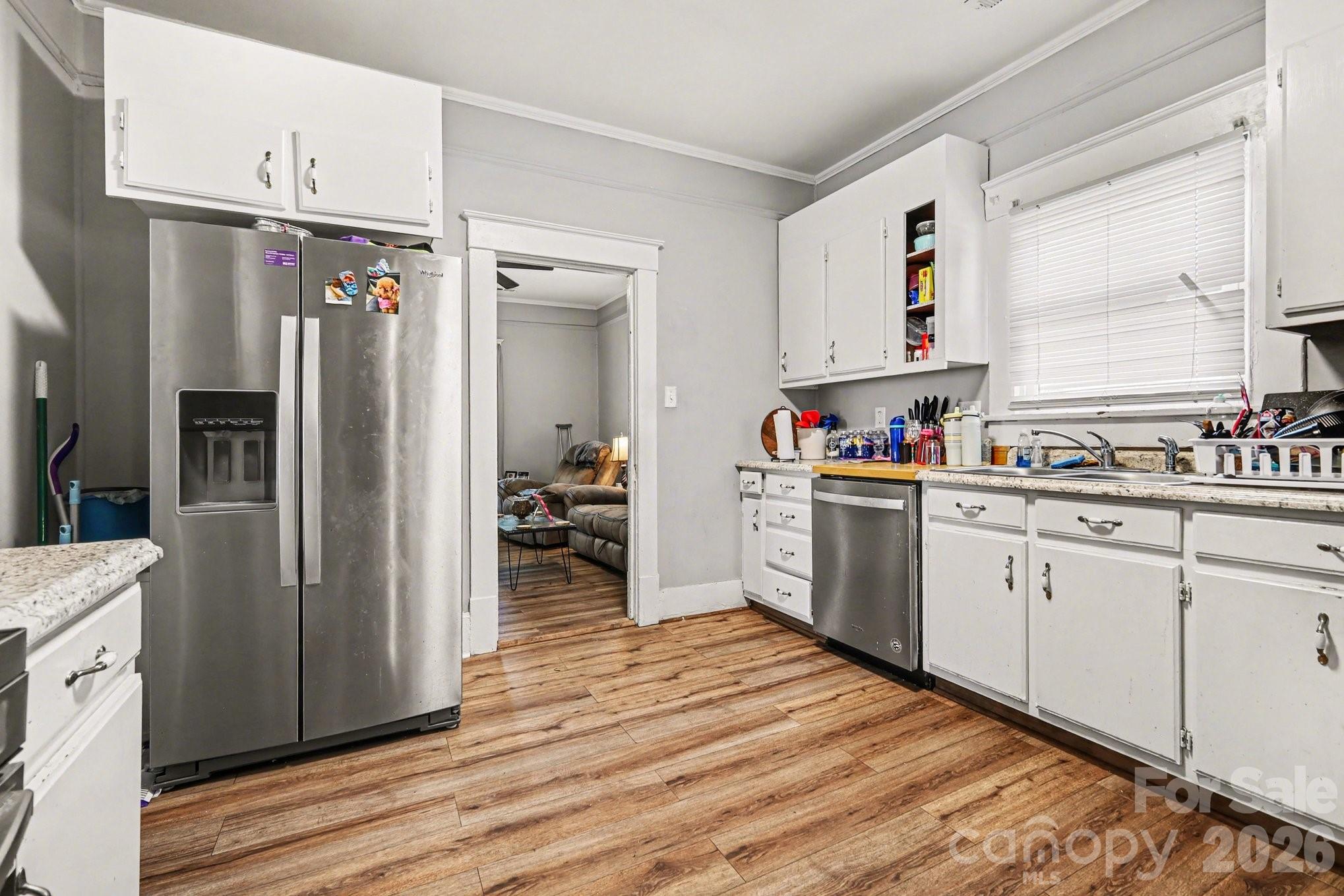 522 Elm Street Salisbury, NC 28144 - Photo 10 of 20 a kitchen with stainless steel appliances a refrigerator sink and cabinets