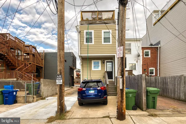 a front view of a house with parking
