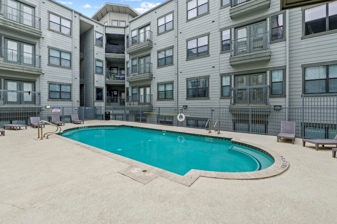 2502 Leon Street, Unit 213 Austin, TX 78705 - Photo 17 of 20 Community pool with a patio