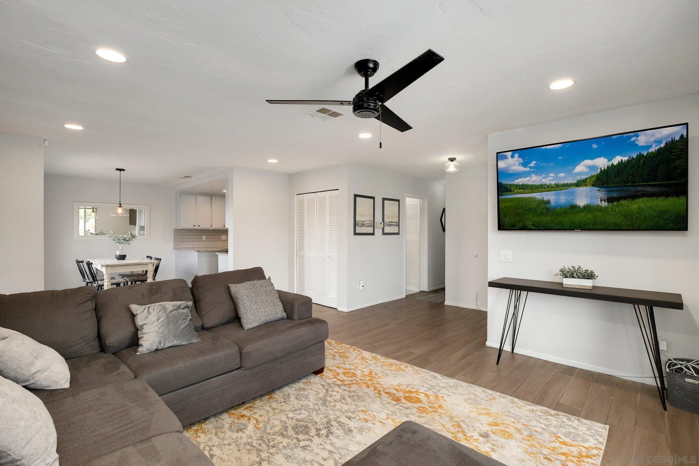 320 Grapevine Road, Unit 15 Vista, CA 92083 - Photo 11 of 18 a living room with furniture and a flat screen tv
