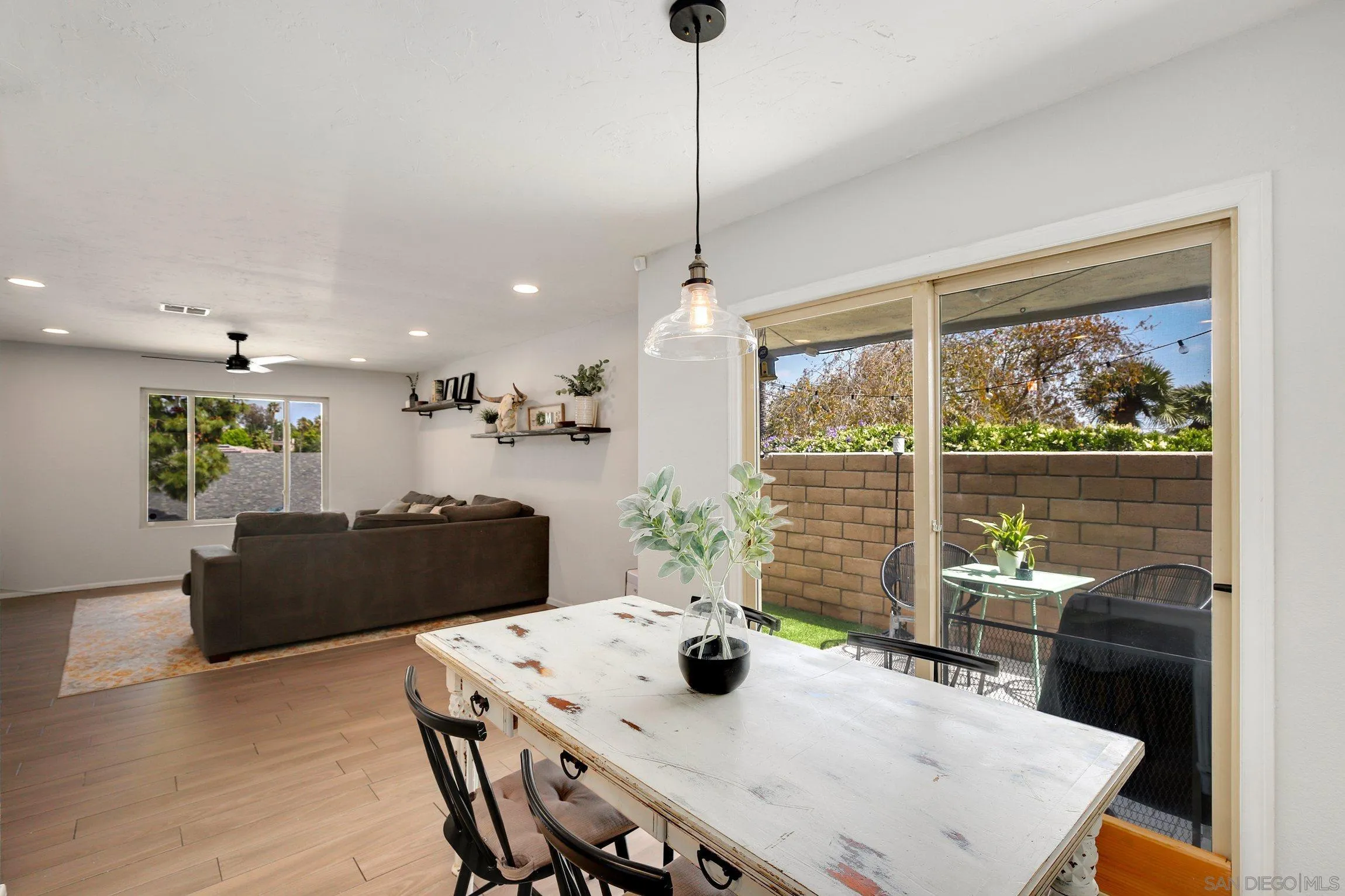 320 Grapevine Road, Unit 15 Vista, CA 92083 - Photo 4 of 18 a view of a dining room with furniture window and wooden floor