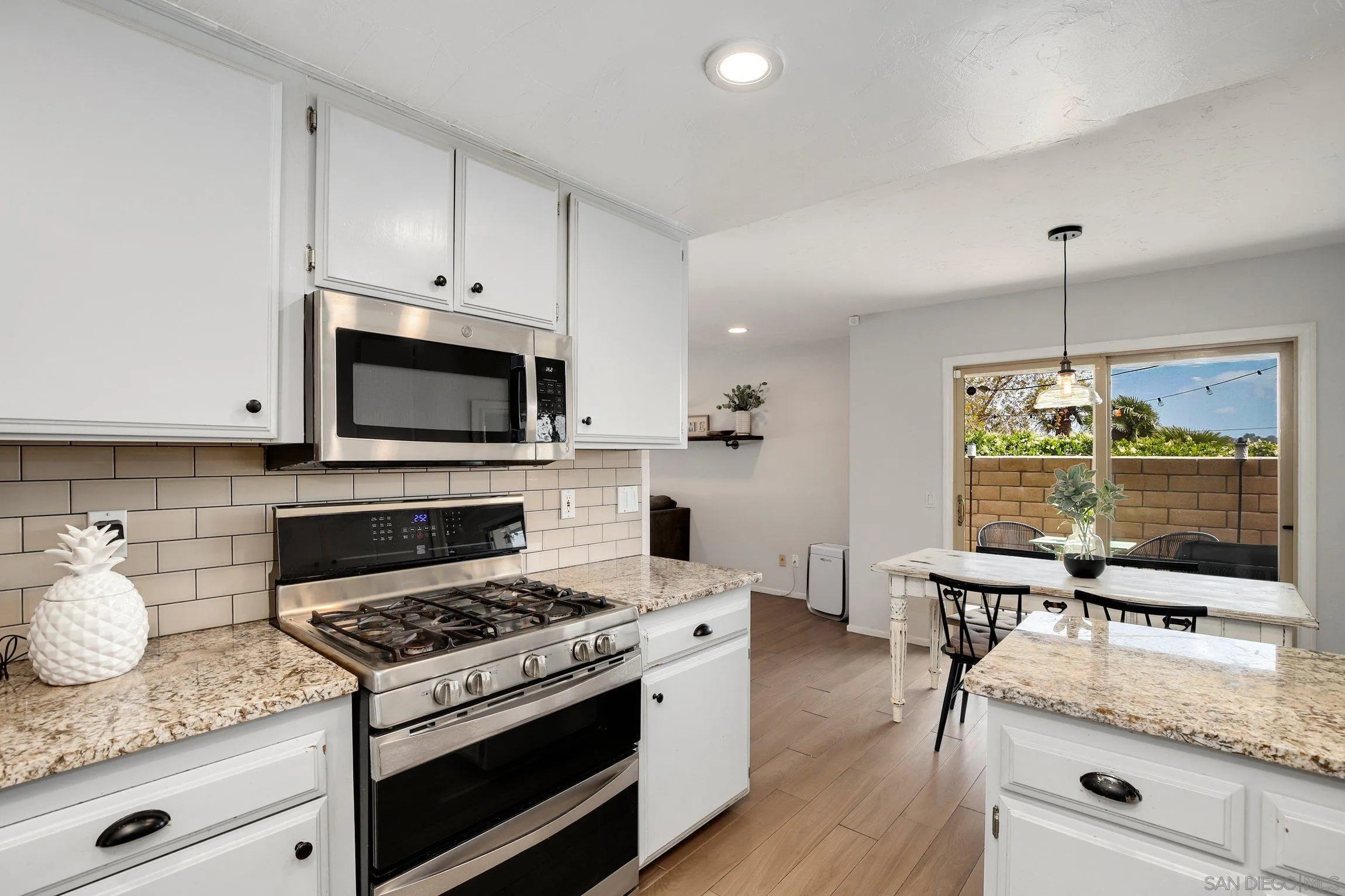 320 Grapevine Road, Unit 15 Vista, CA 92083 - Photo 8 of 18 a kitchen with a stove and a sink