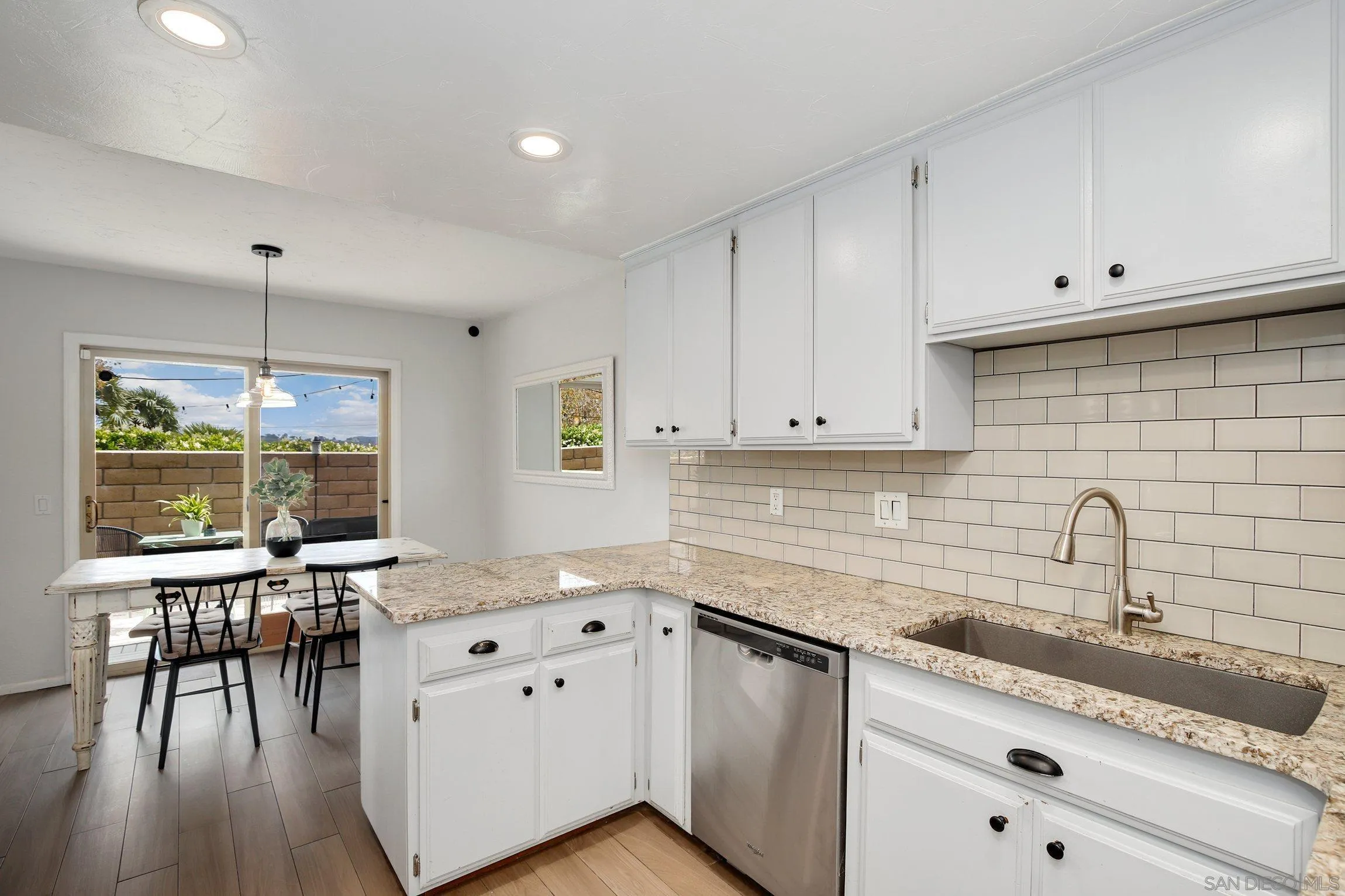 320 Grapevine Road, Unit 15 Vista, CA 92083 - Photo 9 of 18 a kitchen with a sink stove and cabinets