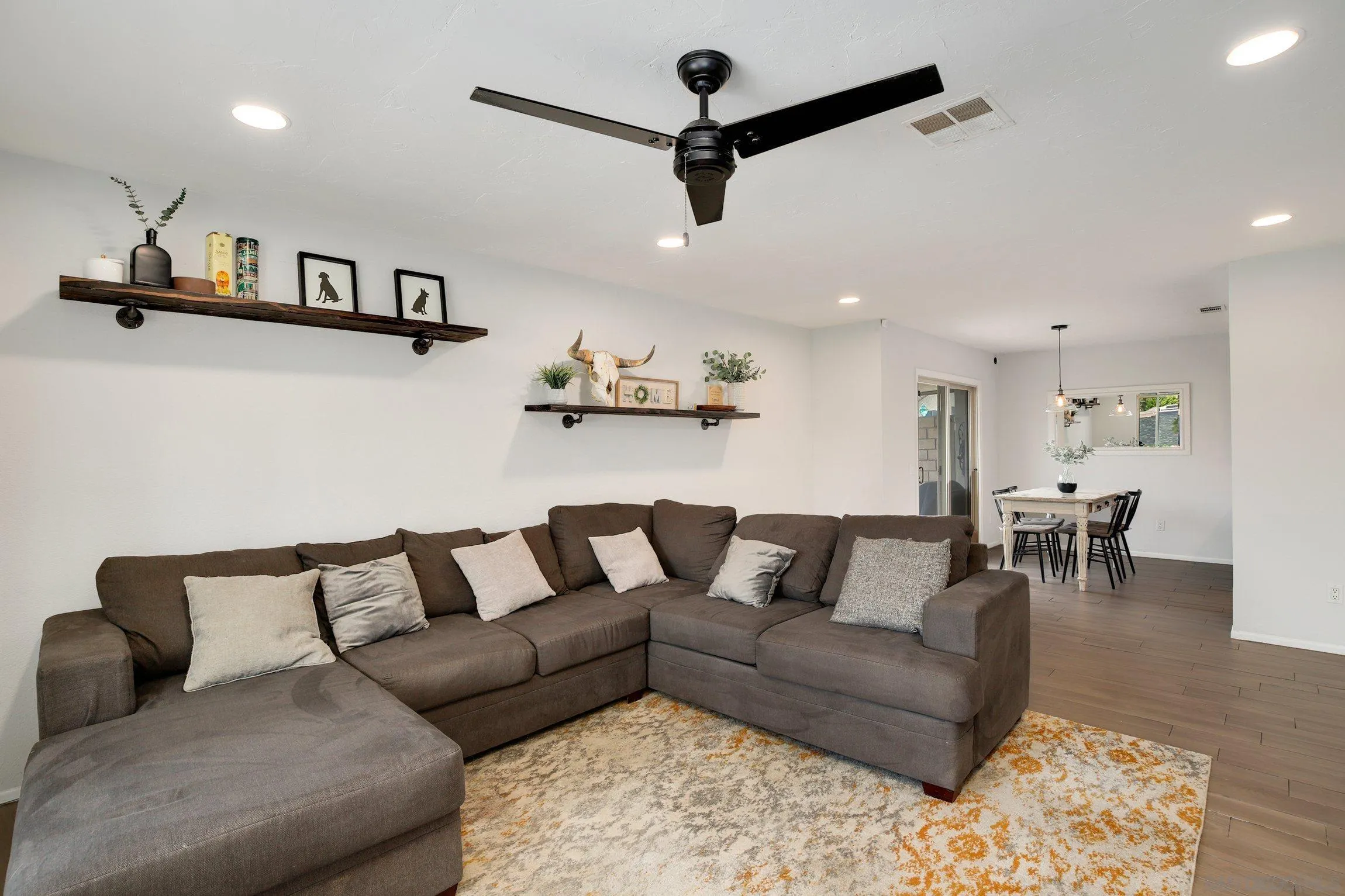 320 Grapevine Road, Unit 15 Vista, CA 92083 - Photo 10 of 18 a living room with furniture and a ceiling fan