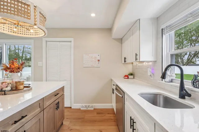 a kitchen with a sink cabinets and a sink