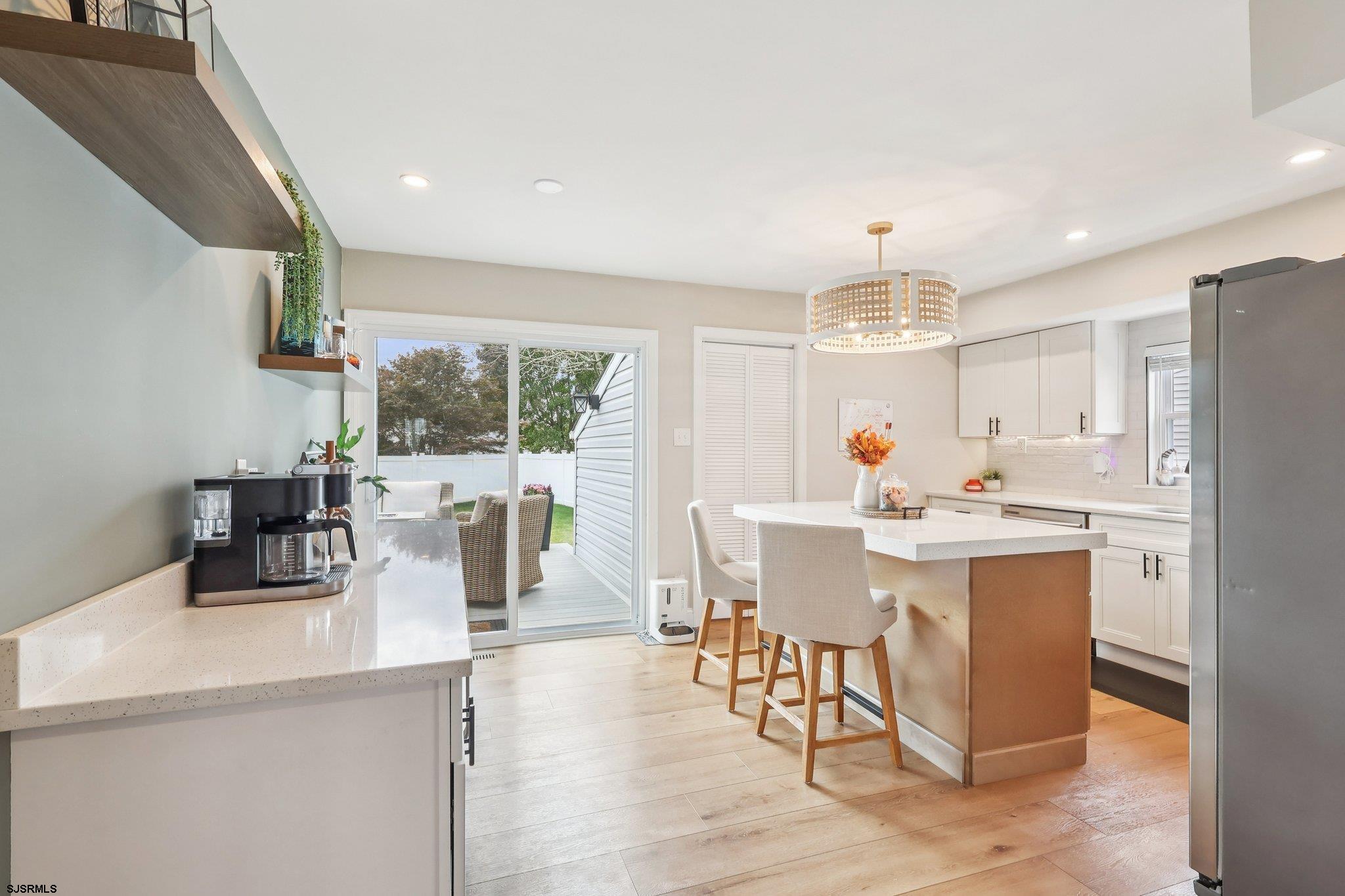 13 Gulph Mill Road Somers Point, NJ 08244 - Photo 17 of 43 a view of a dining room with furniture window and outside view
