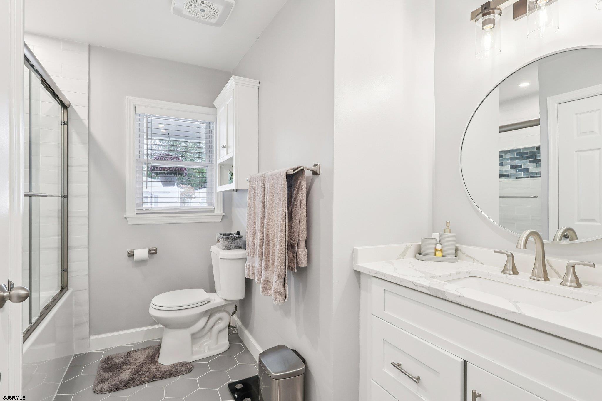 13 Gulph Mill Road Somers Point, NJ 08244 - Photo 18 of 43 a bathroom with a sink toilet and shower