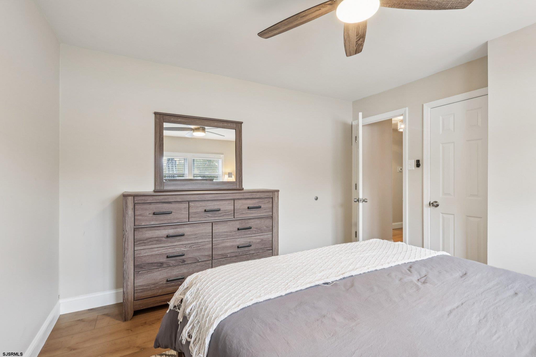 13 Gulph Mill Road Somers Point, NJ 08244 - Photo 20 of 43 a bedroom with a bed and a dresser