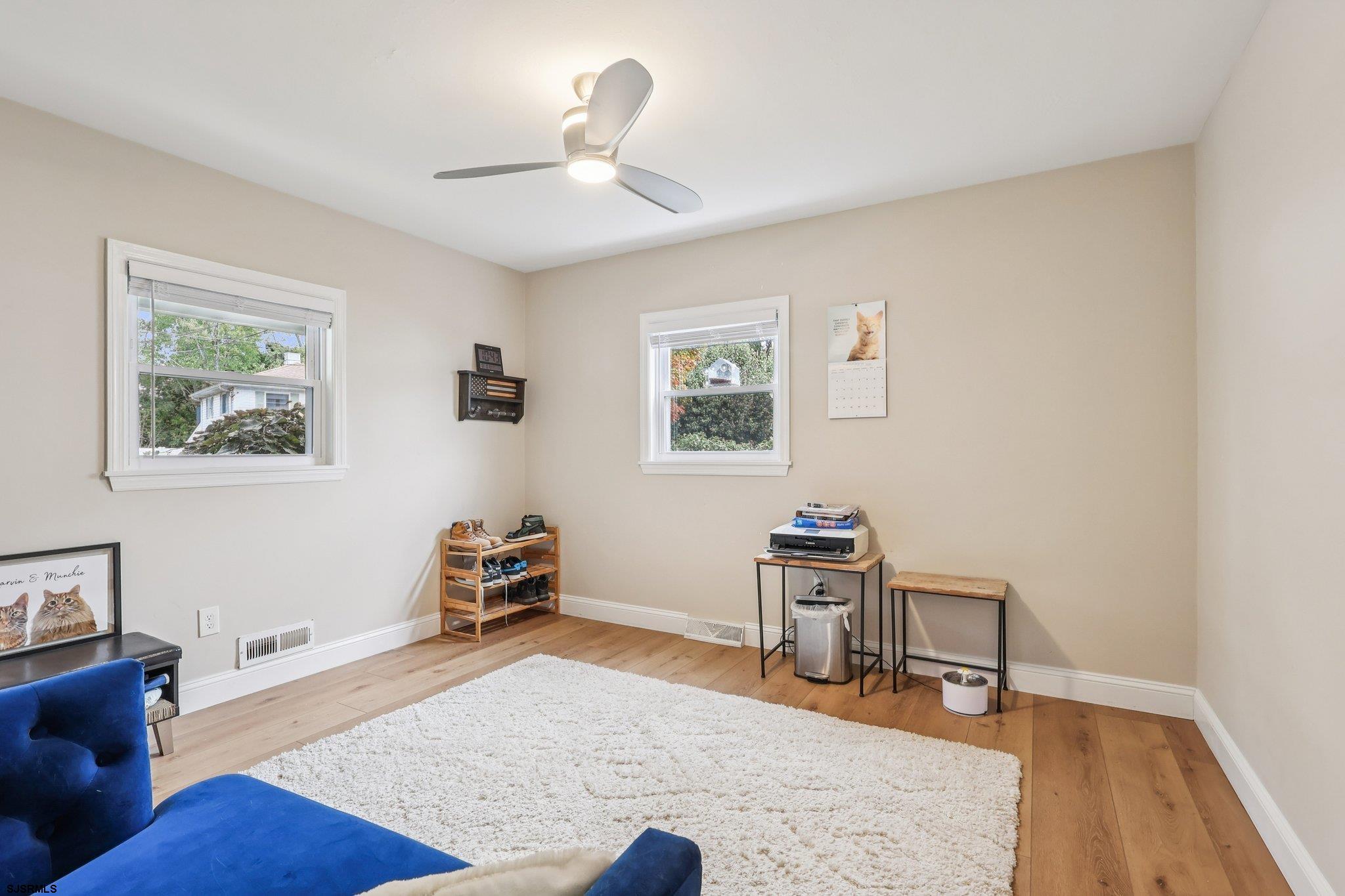 13 Gulph Mill Road Somers Point, NJ 08244 - Photo 25 of 43 a living room with furniture and a wooden floor