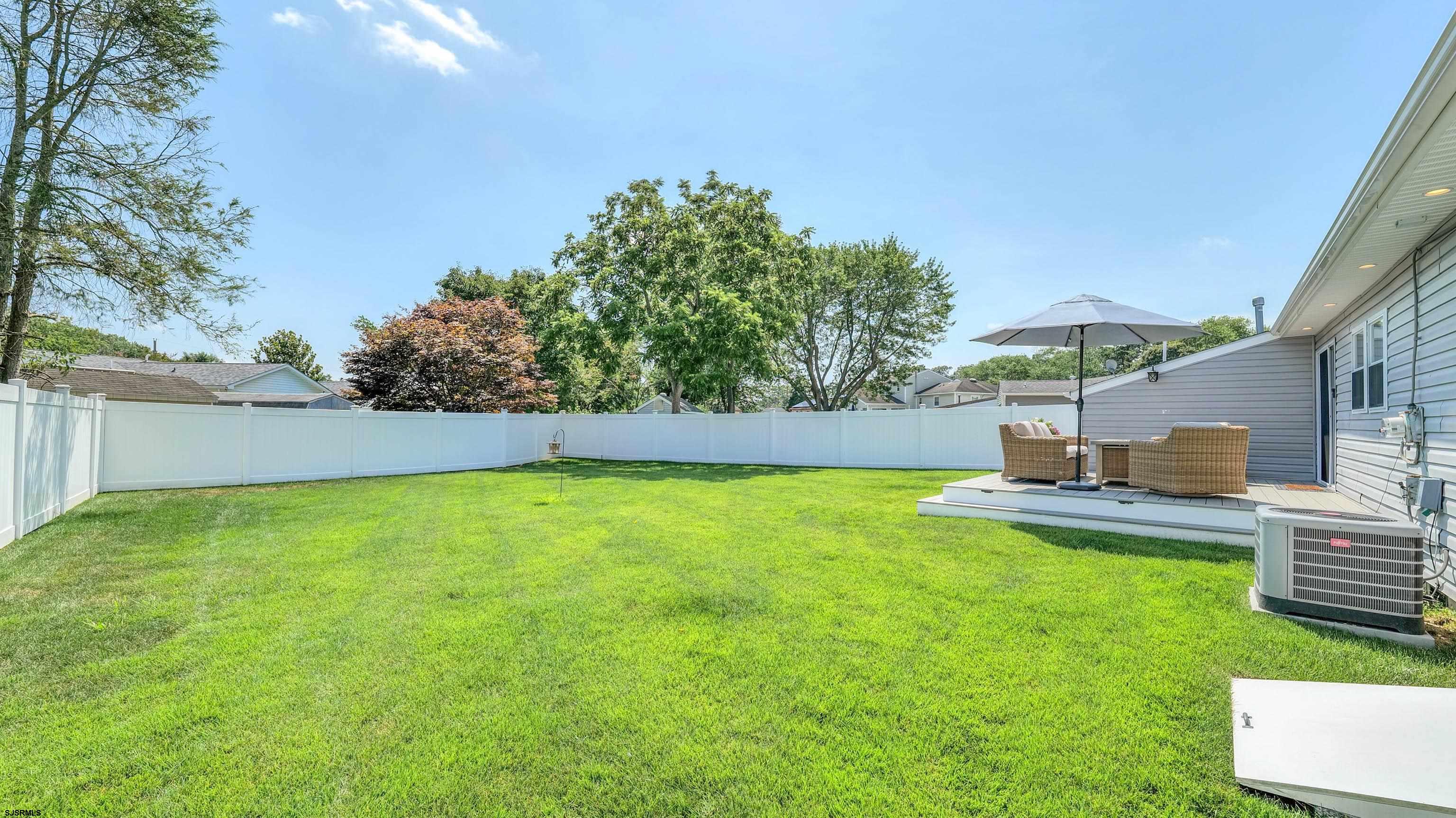 13 Gulph Mill Road Somers Point, NJ 08244 - Photo 35 of 43 a view of a backyard with a garden and fire pit