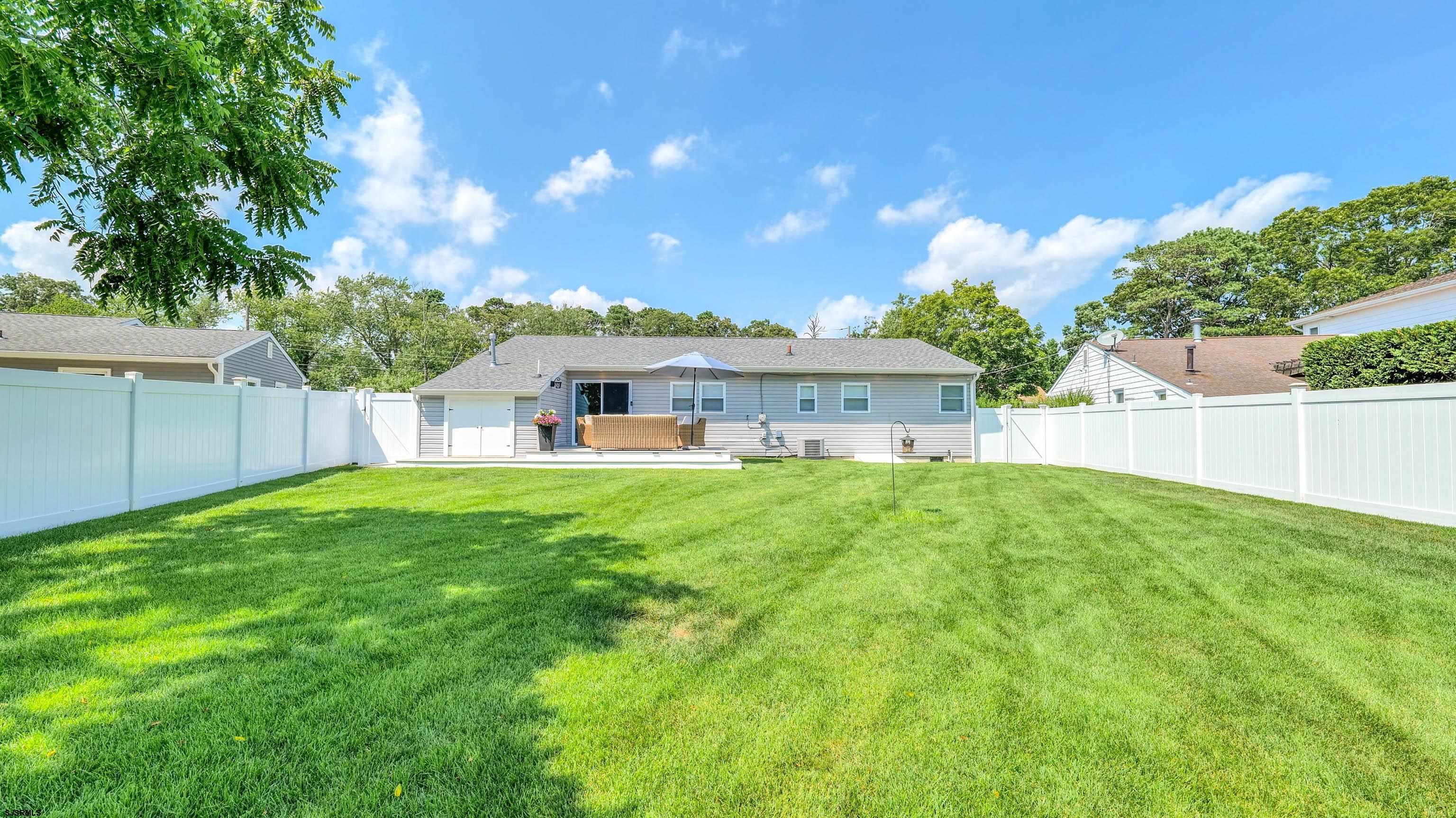 13 Gulph Mill Road Somers Point, NJ 08244 - Photo 37 of 43 a view of house with backyard and a garden