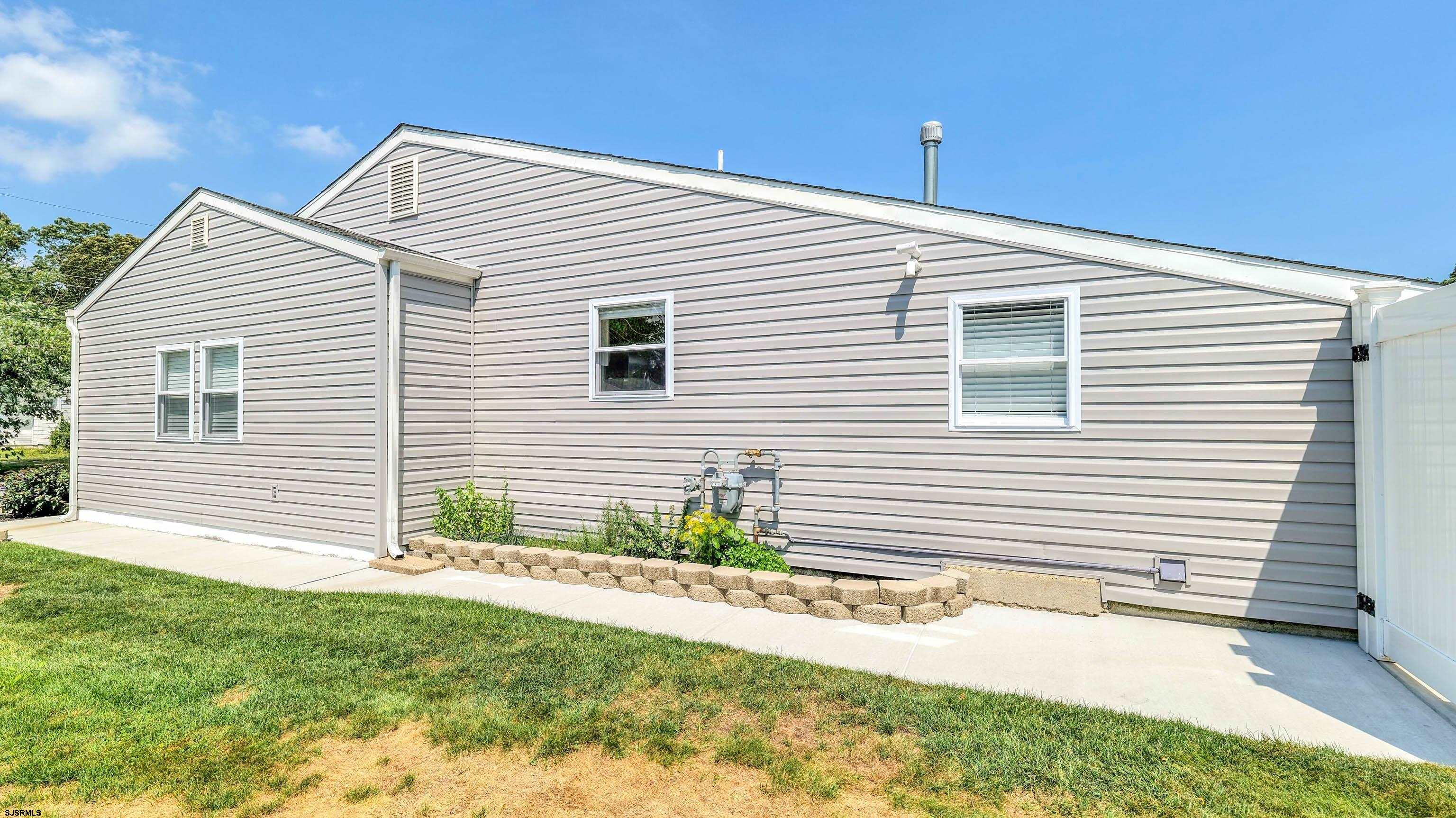 13 Gulph Mill Road Somers Point, NJ 08244 - Photo 42 of 43 a view of a house with a yard and a garage