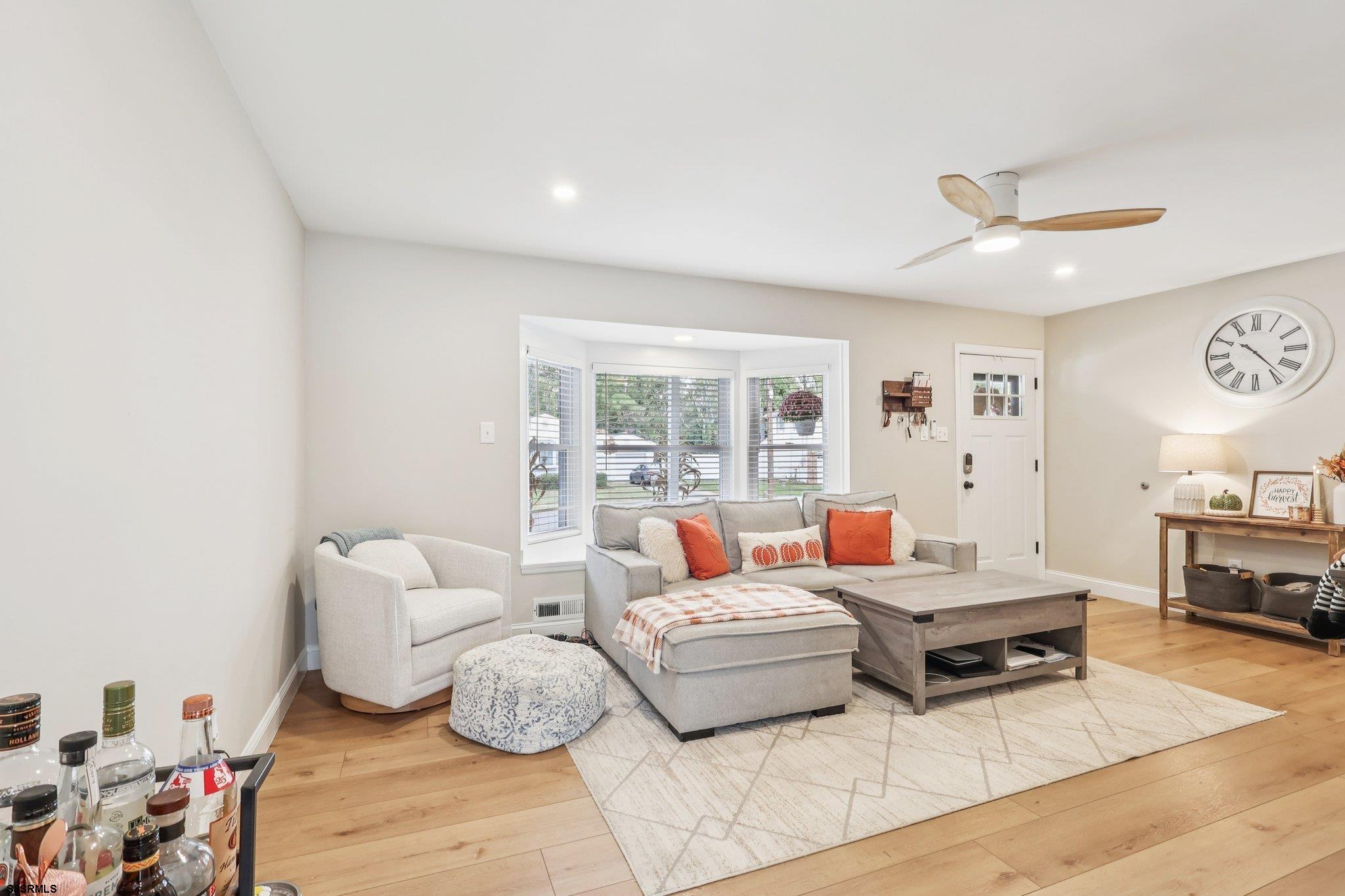 13 Gulph Mill Road Somers Point, NJ 08244 - Photo 6 of 43 a living room with furniture and a large window