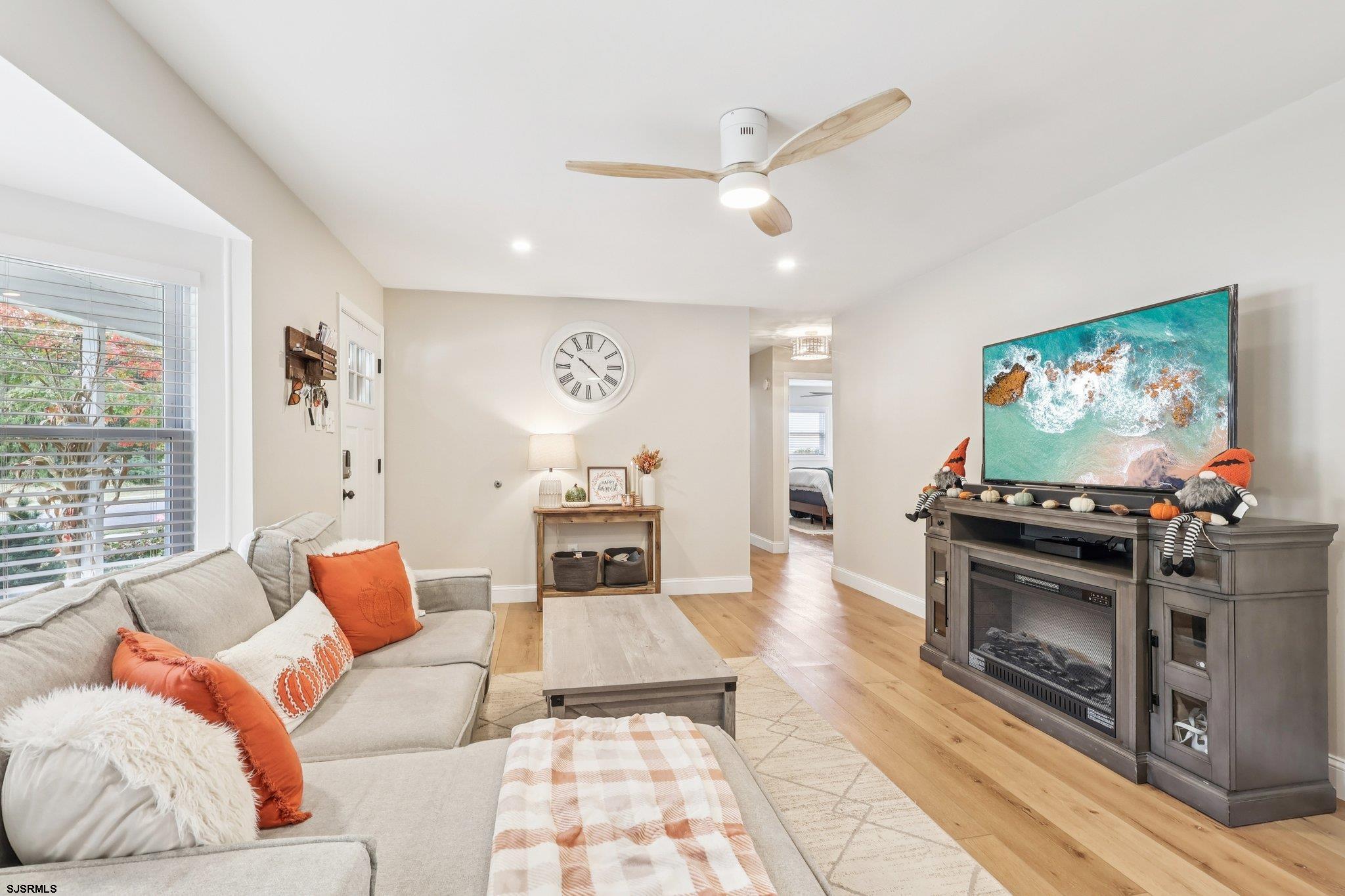 13 Gulph Mill Road Somers Point, NJ 08244 - Photo 7 of 43 a living room with furniture and a flat screen tv