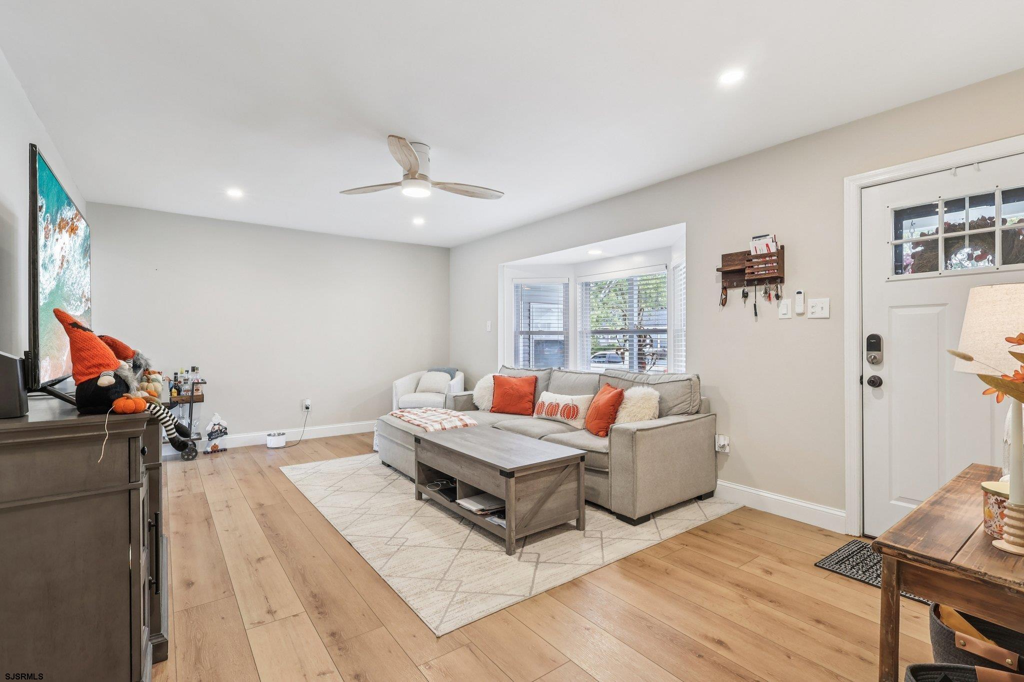 13 Gulph Mill Road Somers Point, NJ 08244 - Photo 9 of 43 a living room with furniture and a flat screen tv