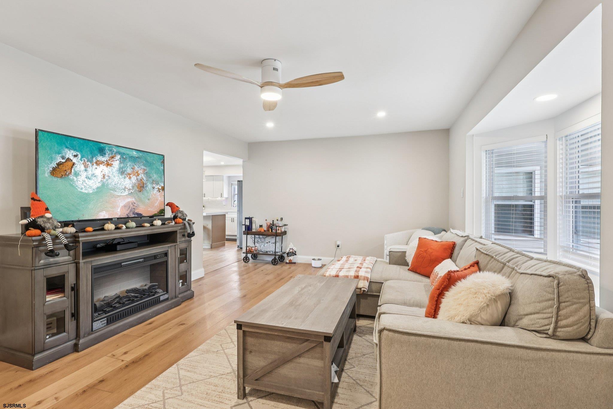 13 Gulph Mill Road Somers Point, NJ 08244 - Photo 10 of 43 a living room with furniture and a flat screen tv