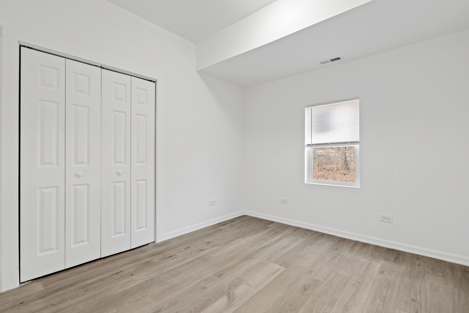 40 West Main Street Chicago Heights, IL 60411 - Photo 11 of 27 an empty room with wooden floor and windows