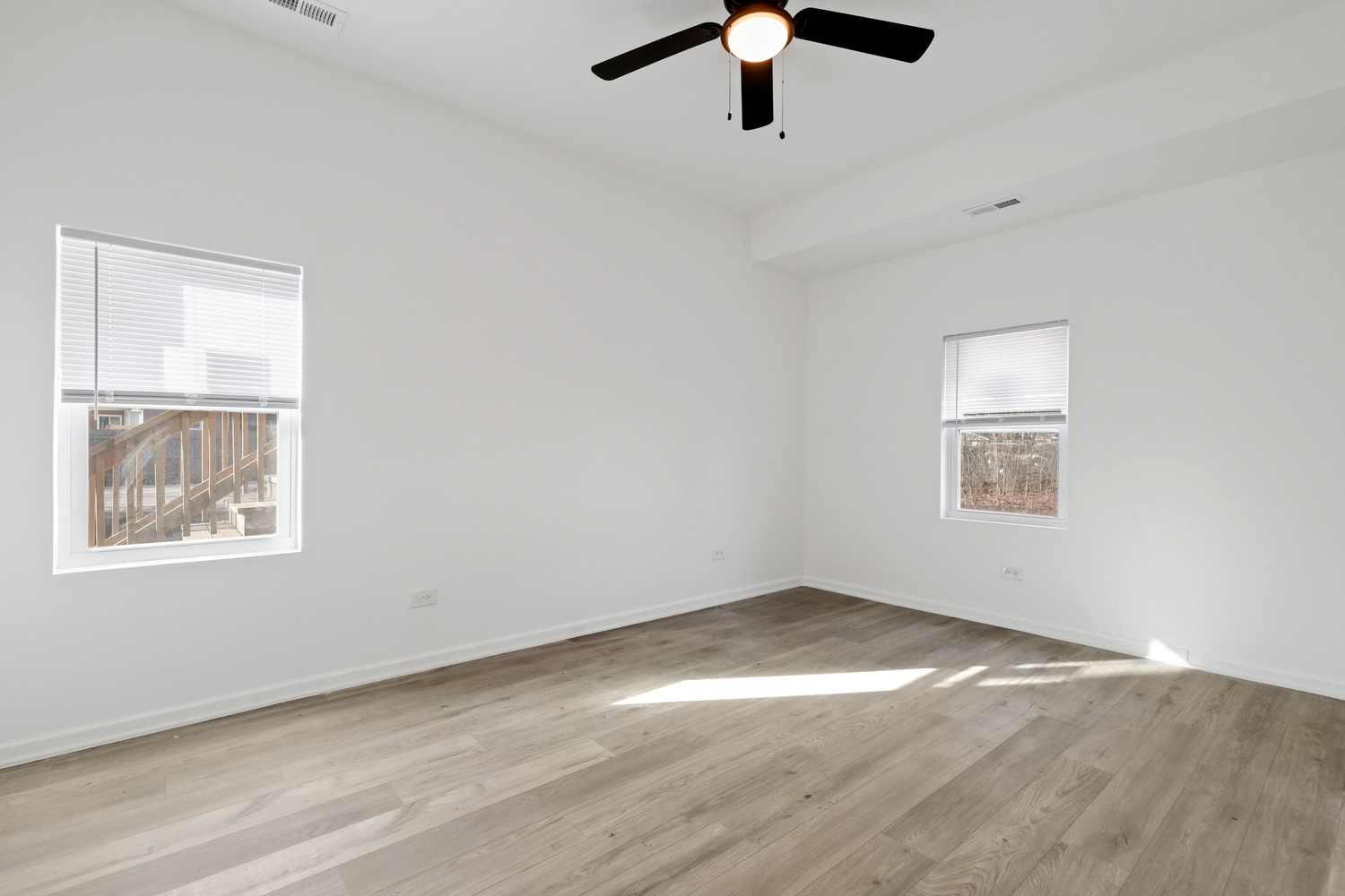 40 West Main Street Chicago Heights, IL 60411 - Photo 13 of 27 an empty room with a window and a ceiling fan