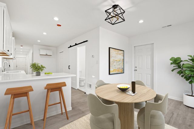 40 West Main Street Chicago Heights, IL 60411 - Photo 15 of 27 a view of a dining room with furniture and wooden floor