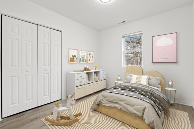 40 West Main Street Chicago Heights, IL 60411 - Photo 19 of 27 a bedroom with a bed and a window
