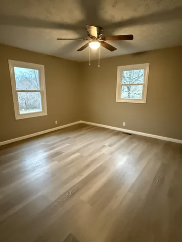 a view of an empty room with a window