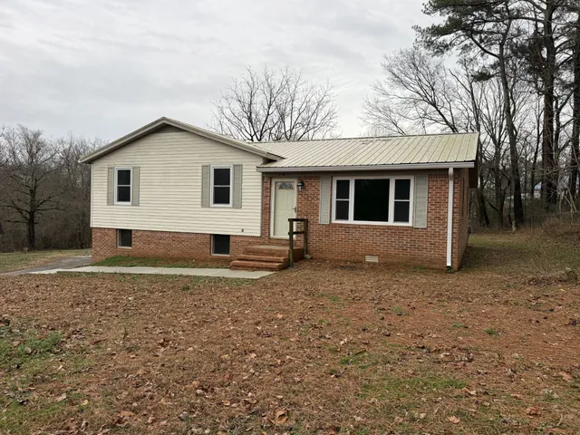 a house with trees in the background