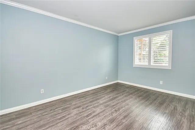 a living room with furniture a dining table and a chandelier