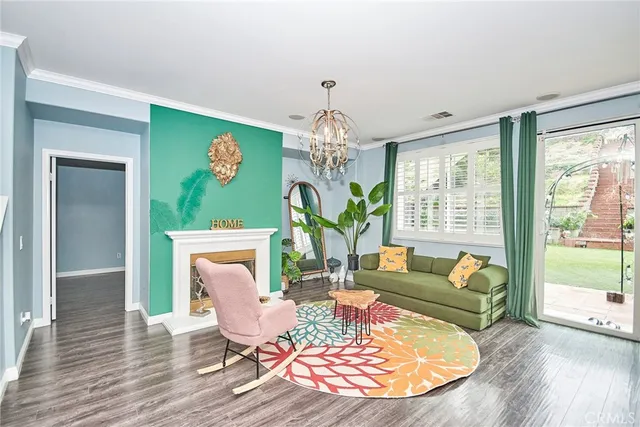 a kitchen with kitchen island a stove a refrigerator and a sink