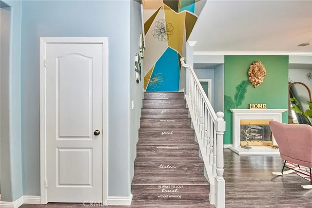 a room with stainless steel appliances kitchen island granite countertop a stove a sink and a dining table