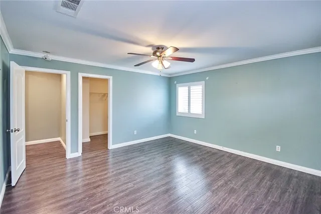 a bed sitting in a room next to a window