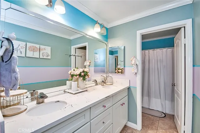 a living room with a bed dresser and a window