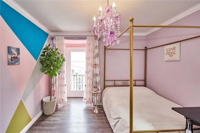 a view of a backyard with plants and brick wall