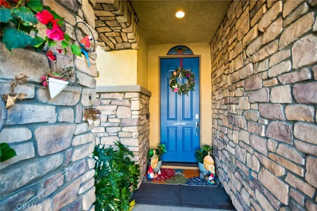a front view of a house with a yard and fountain