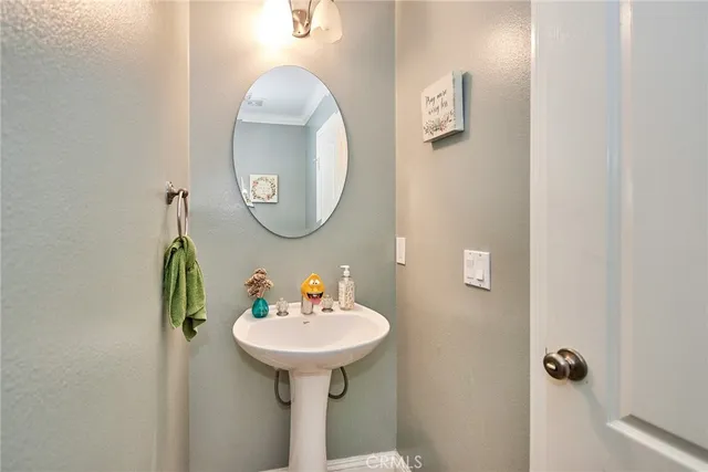 a bathroom with a granite countertop toilet sink and shower
