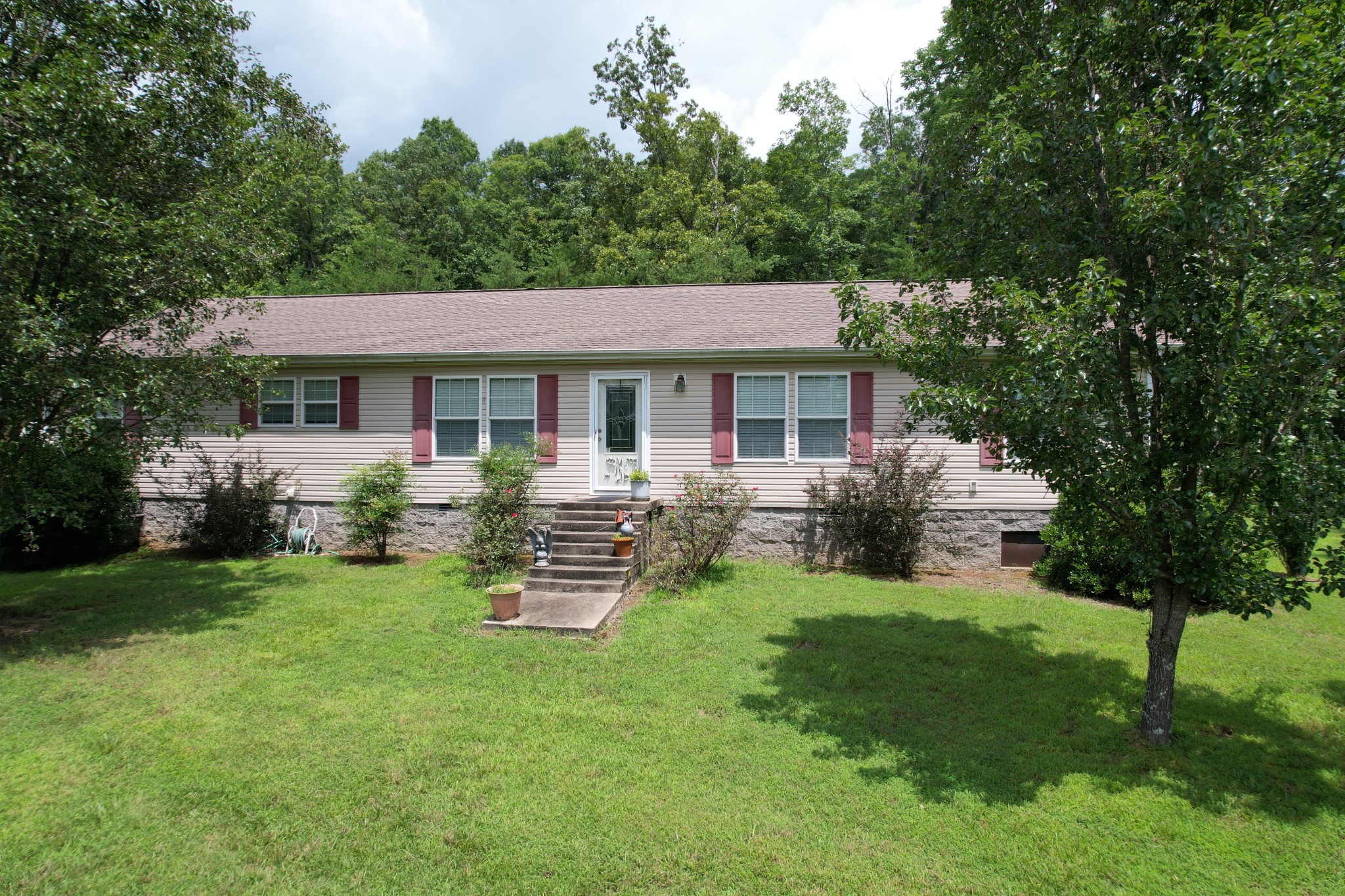 a view of a house with a yard porch and sitting area