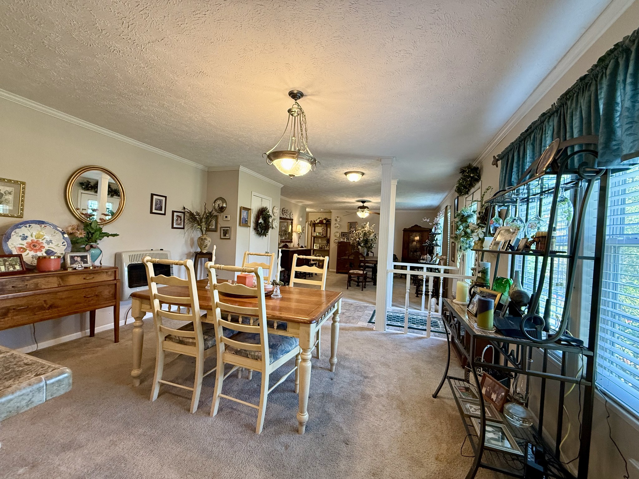 1640 Bucket Branch Road Waverly, TN 37185 - Photo 11 of 38 a view of a dining room with furniture and a chandelier
