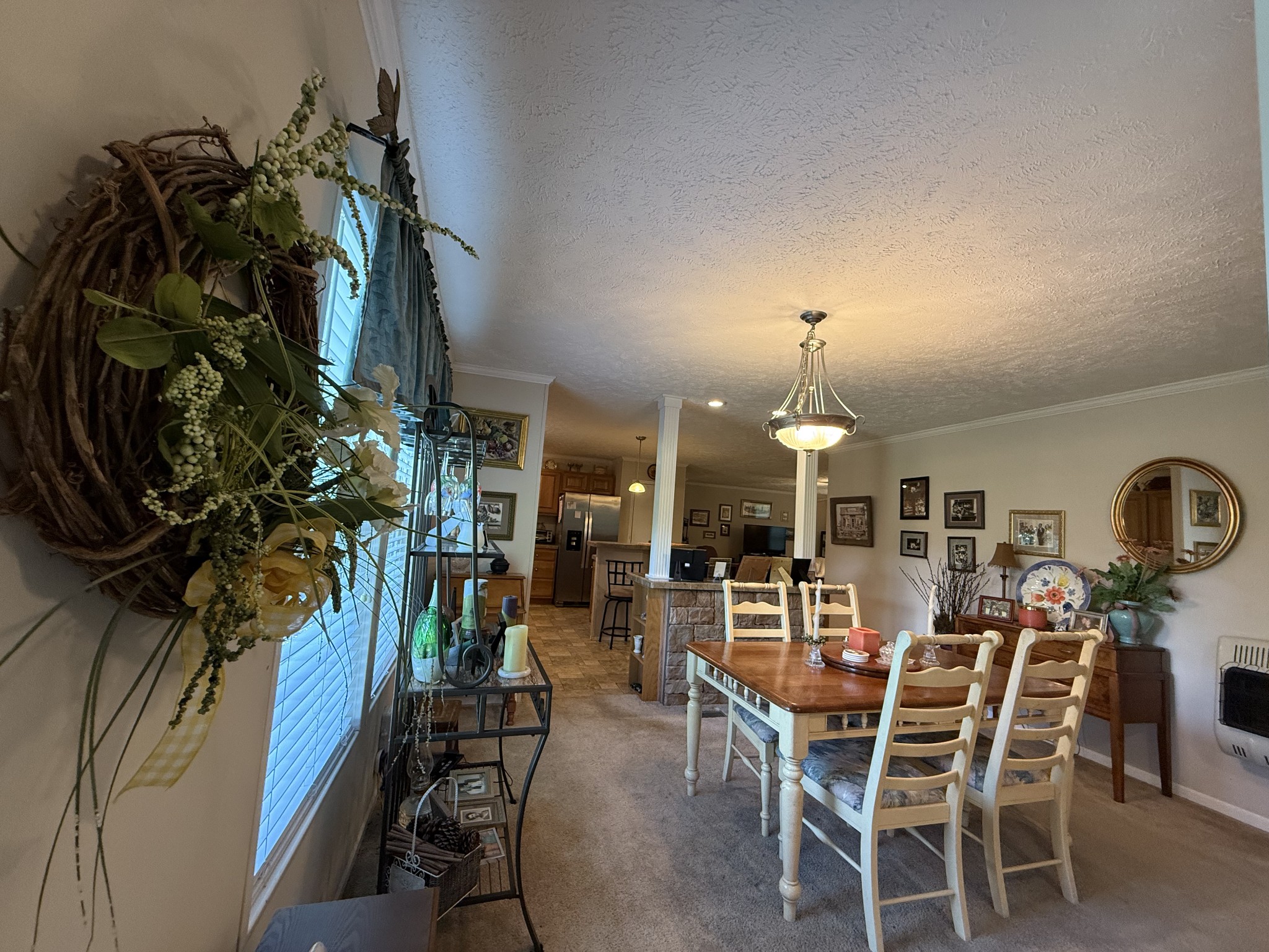 1640 Bucket Branch Road Waverly, TN 37185 - Photo 12 of 38 a view of a dining room with furniture and chandelier