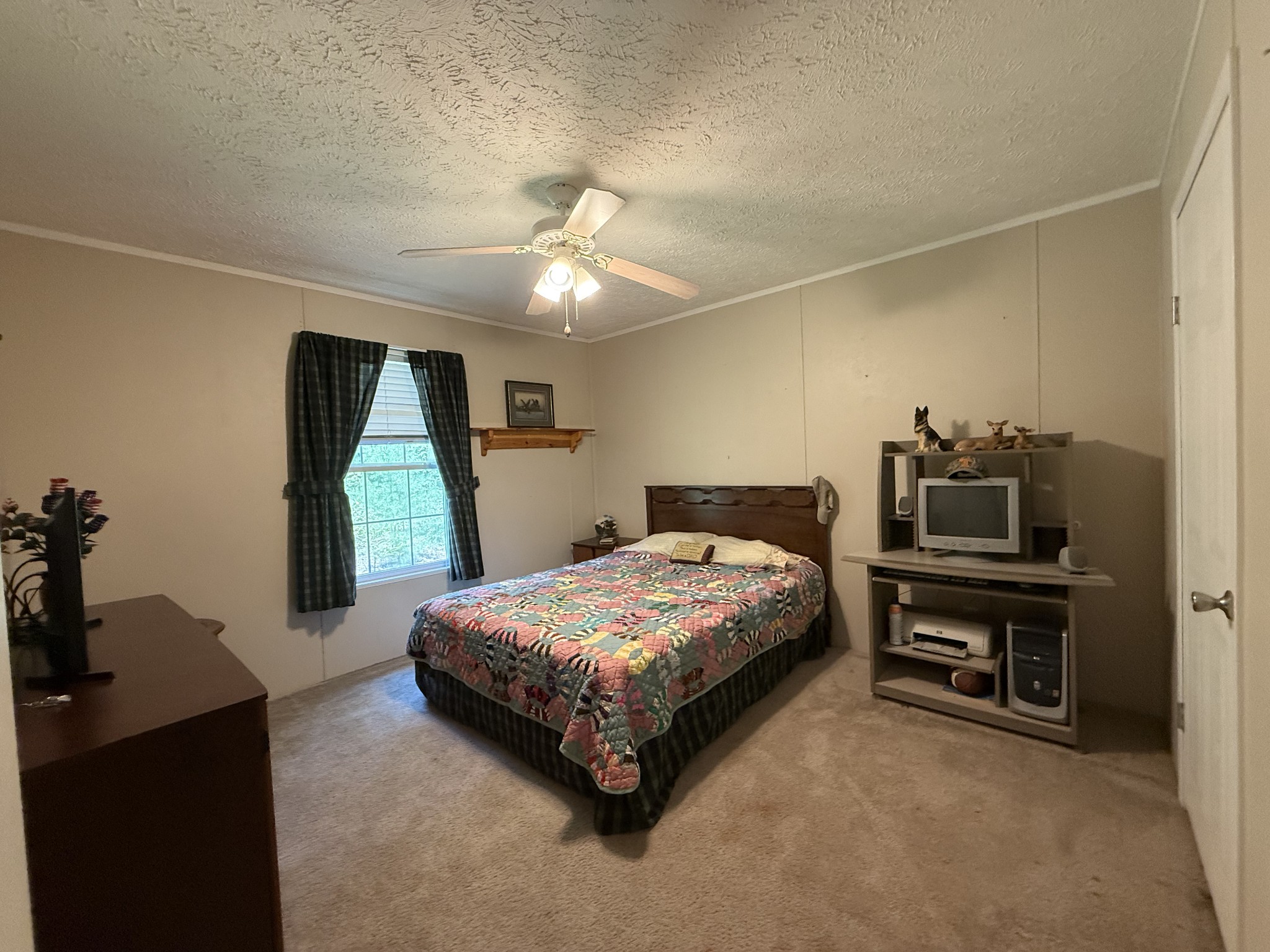 1640 Bucket Branch Road Waverly, TN 37185 - Photo 19 of 38 a bedroom with a bed and a dresser