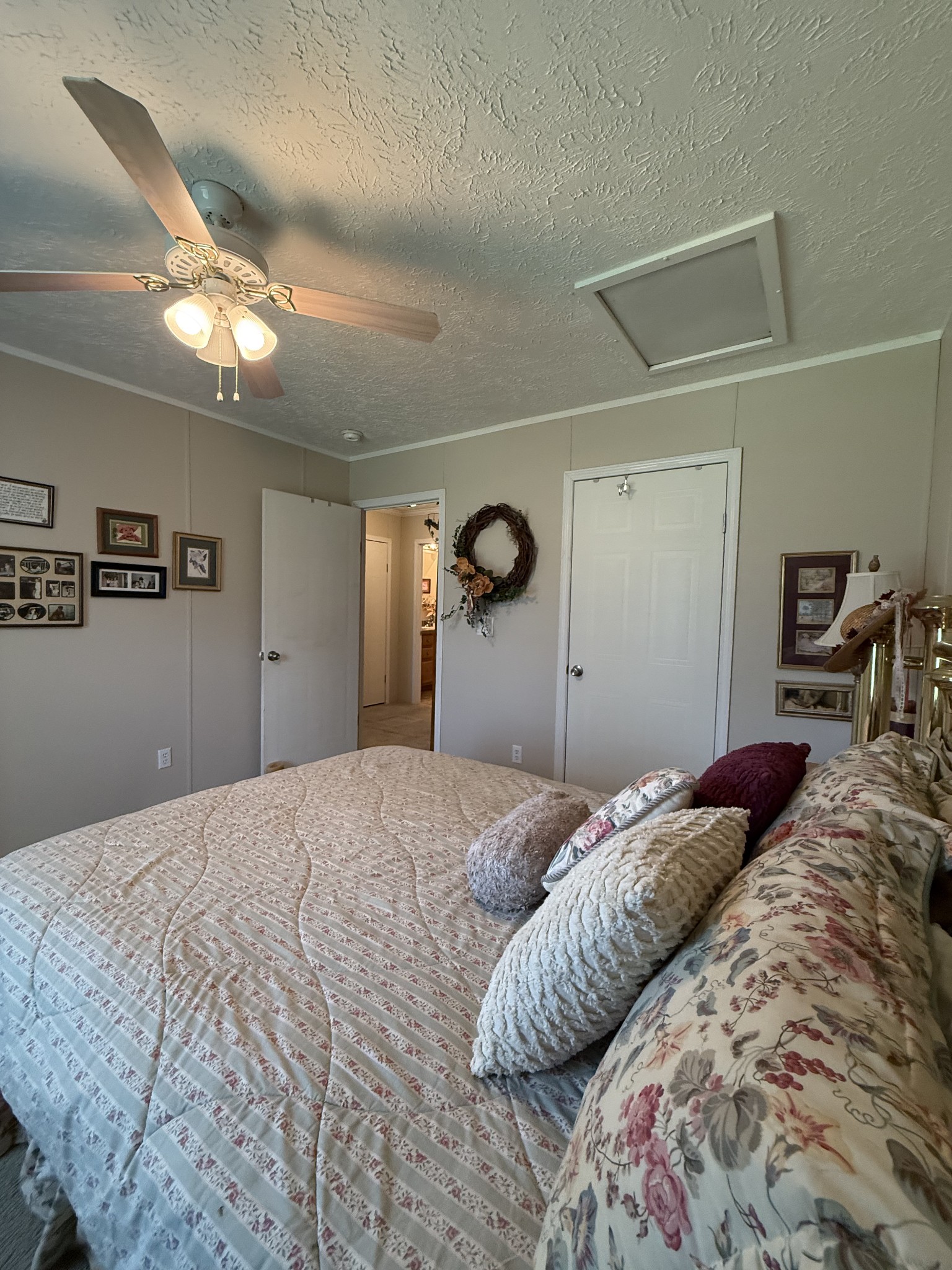 1640 Bucket Branch Road Waverly, TN 37185 - Photo 26 of 38 a bedroom with a bed and a walk in closet