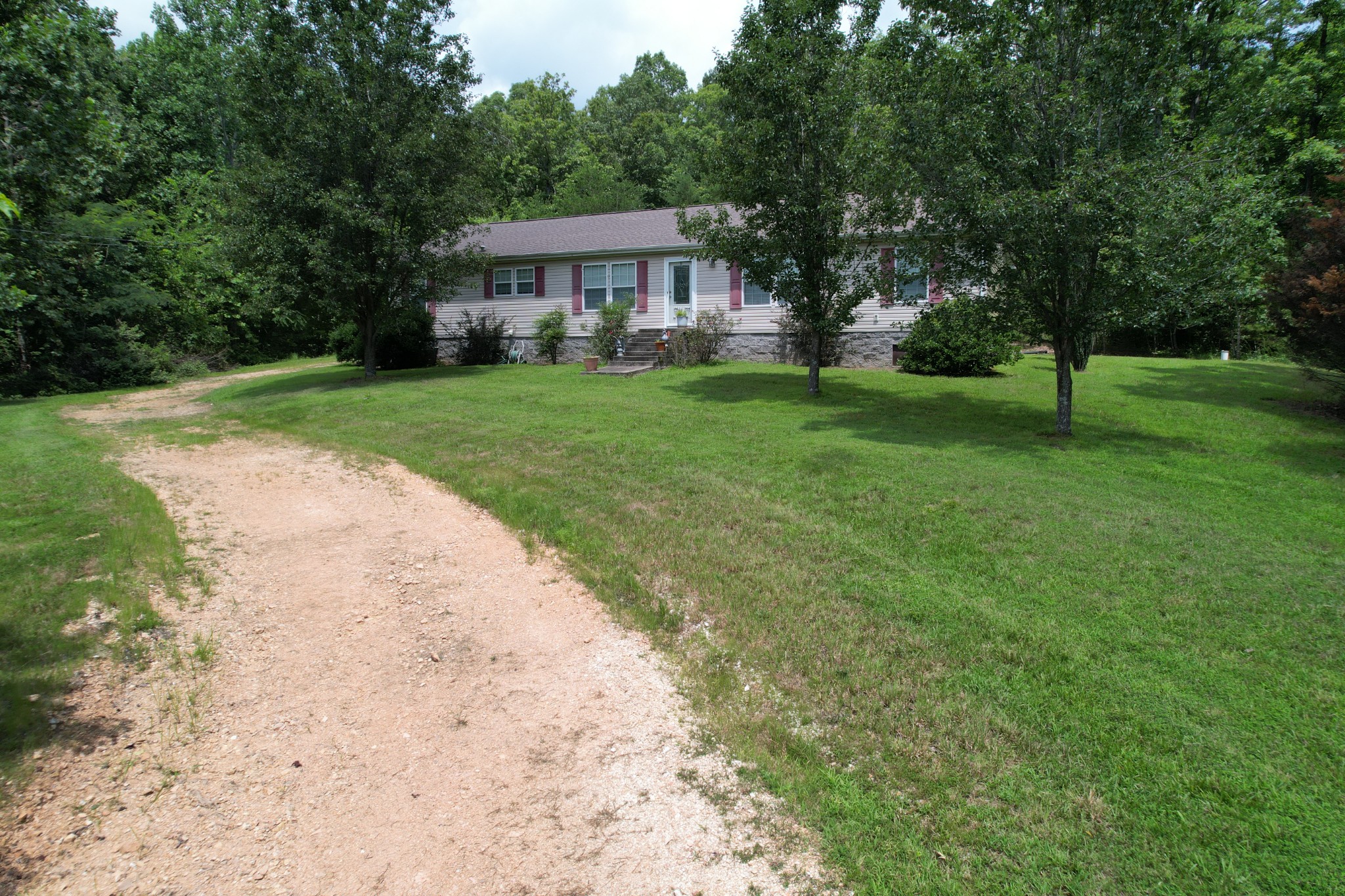 1640 Bucket Branch Road Waverly, TN 37185 - Photo 30 of 38 a front view of a house with a yard