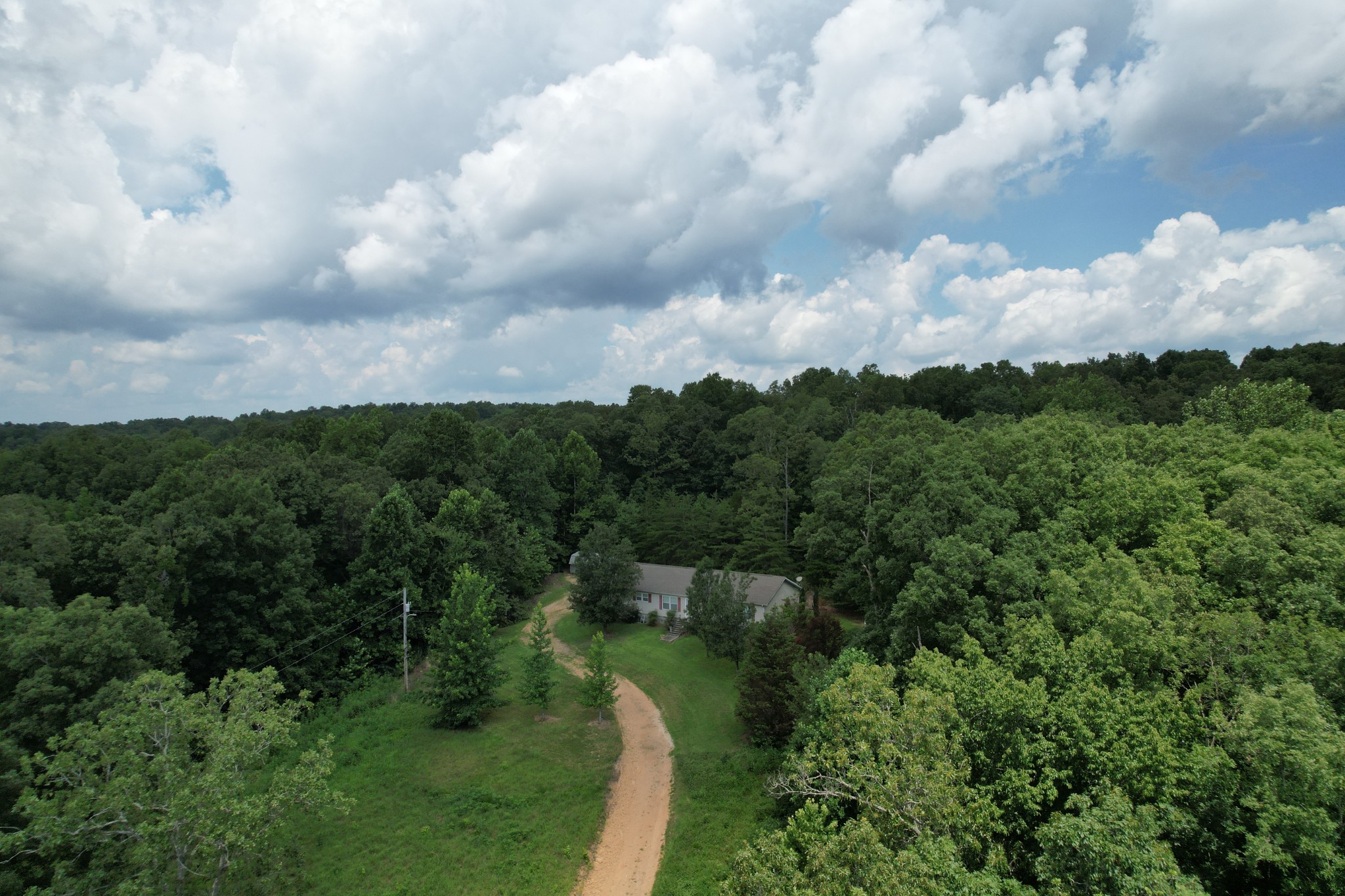 1640 Bucket Branch Road Waverly, TN 37185 - Photo 33 of 38 a view of a lake with houses in back
