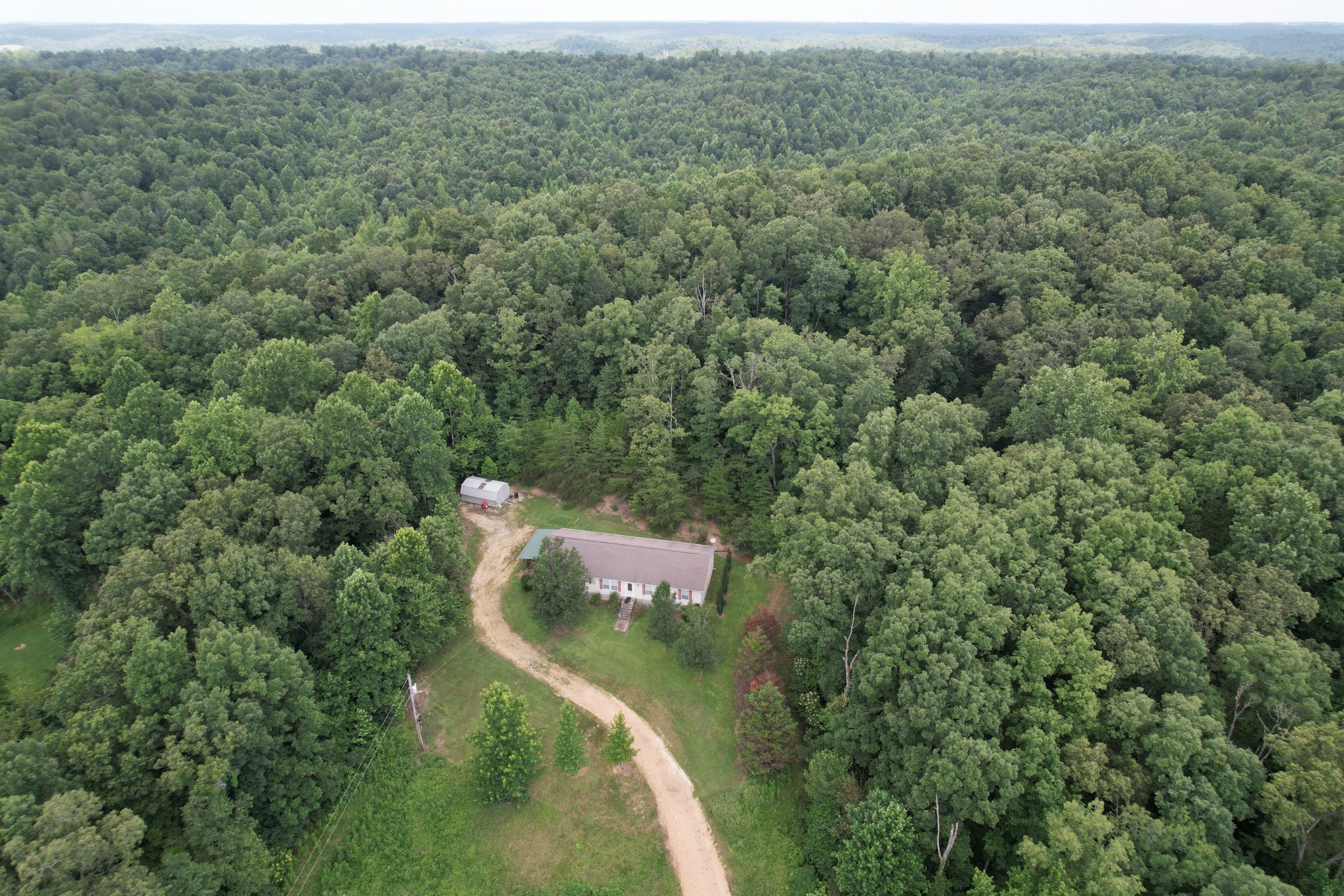 1640 Bucket Branch Road Waverly, TN 37185 - Photo 34 of 38 an aerial view of a house with a yard