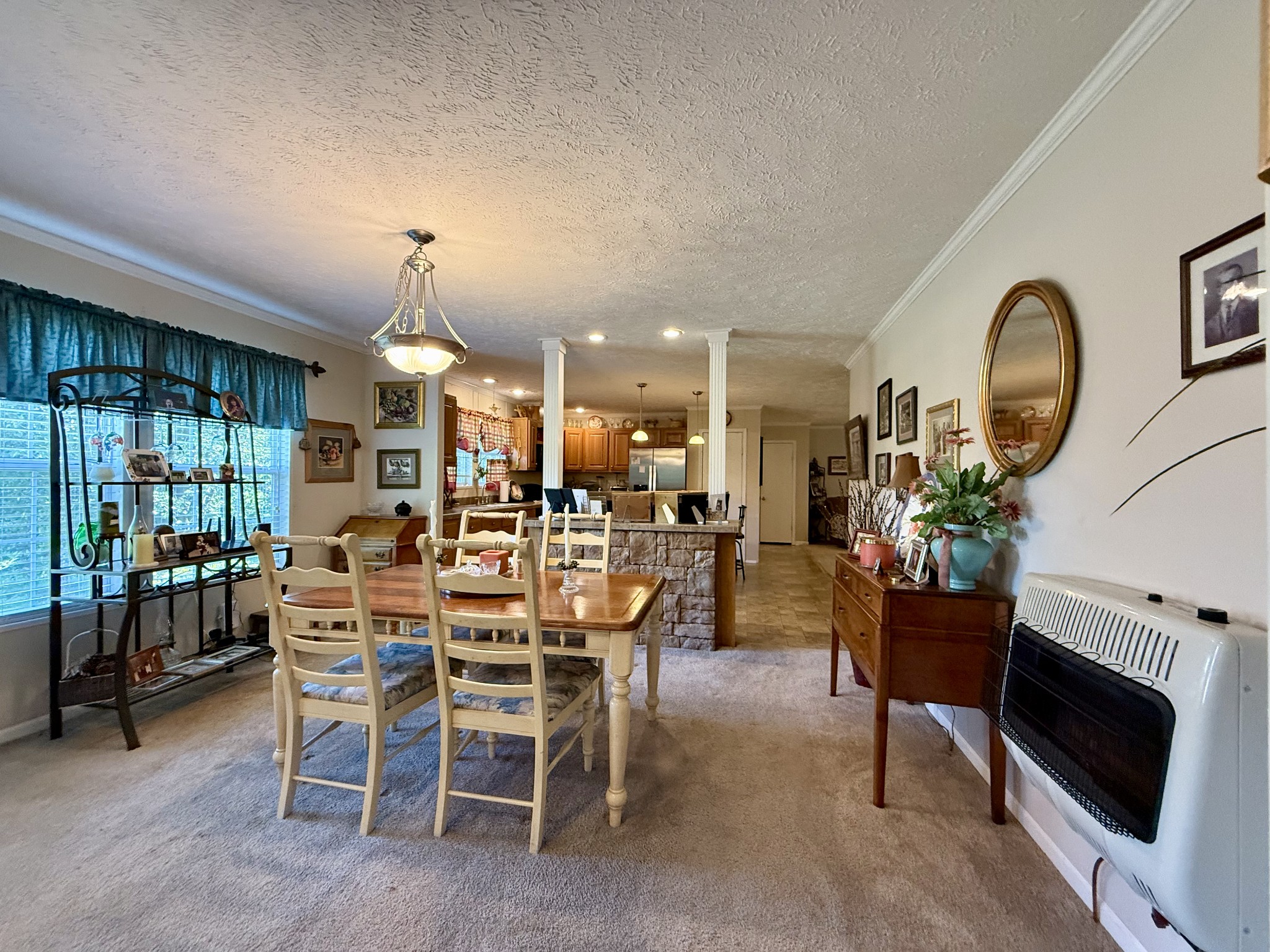 1640 Bucket Branch Road Waverly, TN 37185 - Photo 10 of 38 a view of a dining room with furniture window and outside view