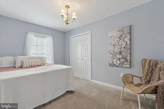 a bedroom with a bed and a chair