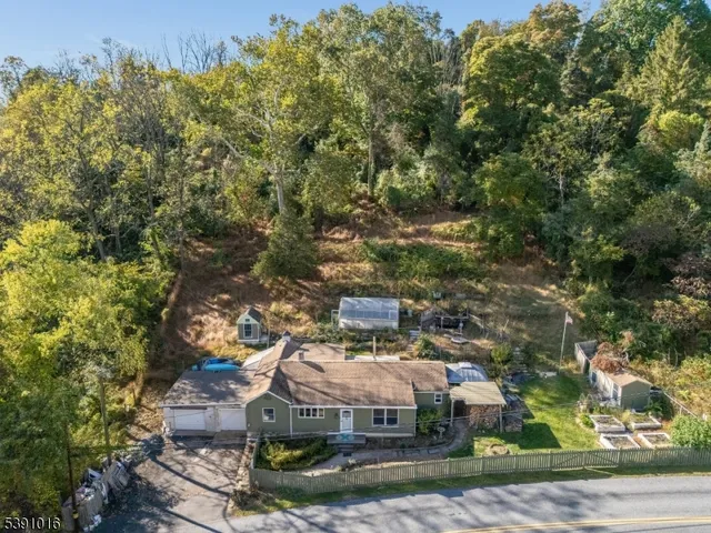 an aerial view of a house with yard