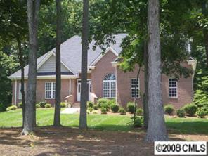 280 Patternote Road Mooresville, NC 28117 - Photo 1 of 8 a view of a brick house with a yard and large tree
