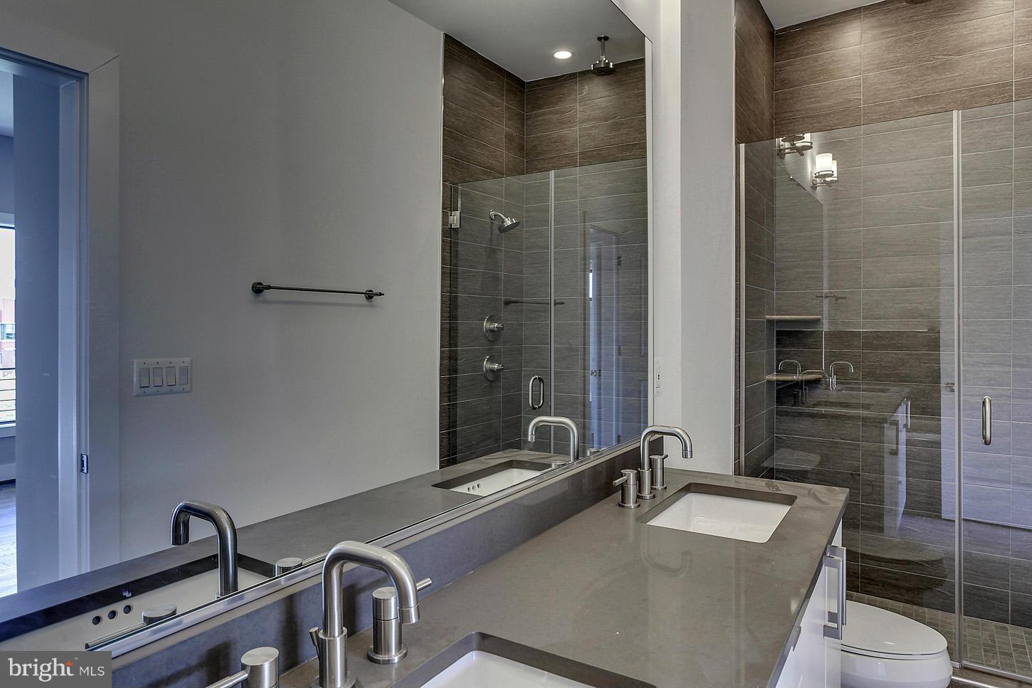 1839 6th Street Northwest, Unit 4 Washington, DC 20001 - Photo 25 of 29 a bathroom with a sink and a mirror