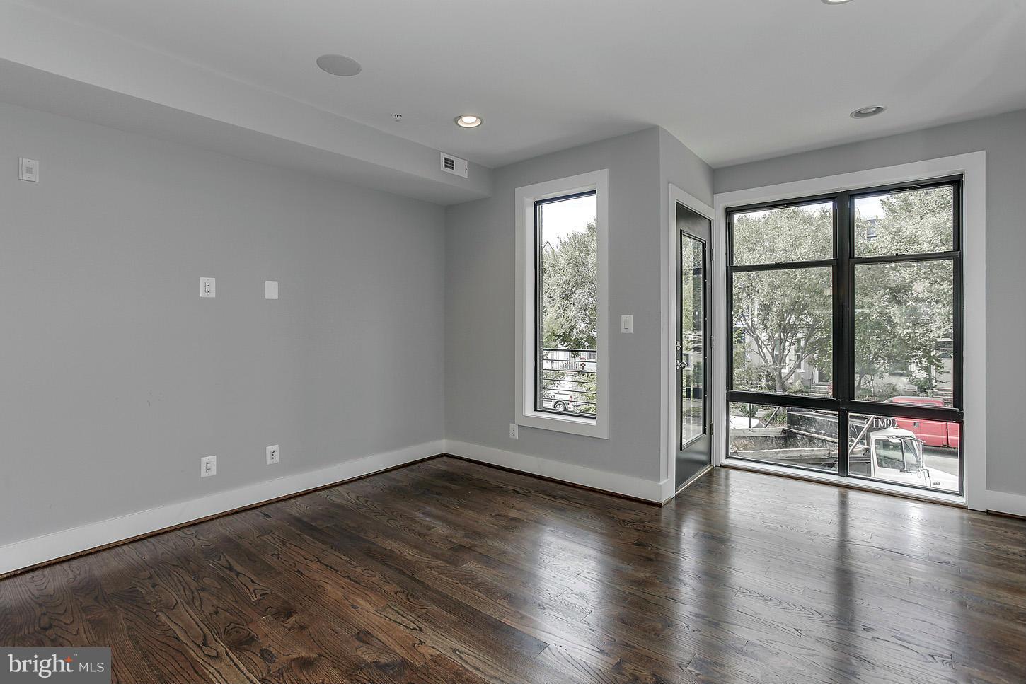 1839 6th Street Northwest, Unit 4 Washington, DC 20001 - Photo 5 of 29 wooden floor in an empty room with a window
