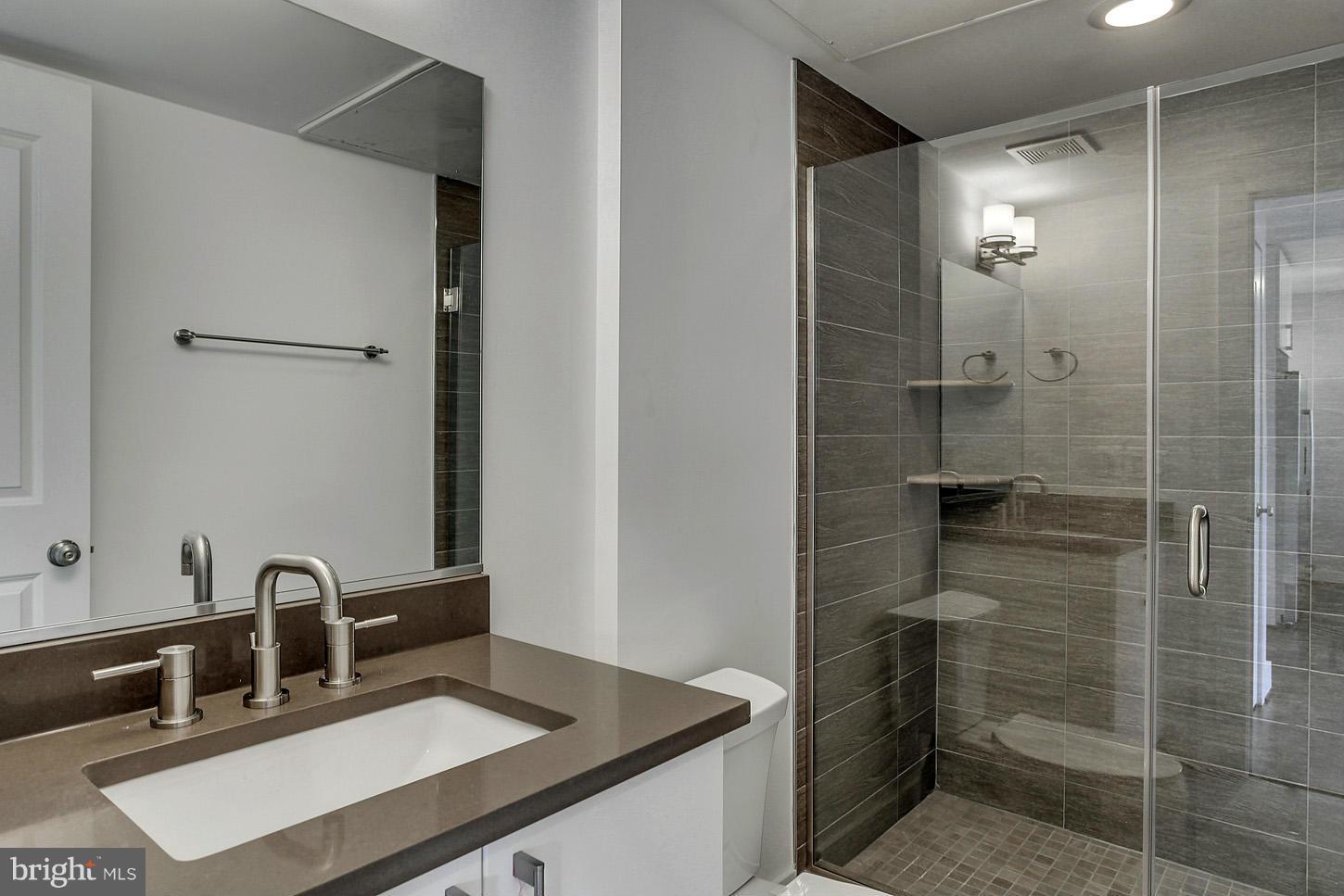 1839 6th Street Northwest, Unit 4 Washington, DC 20001 - Photo 7 of 29 a bathroom with a sink and a mirror